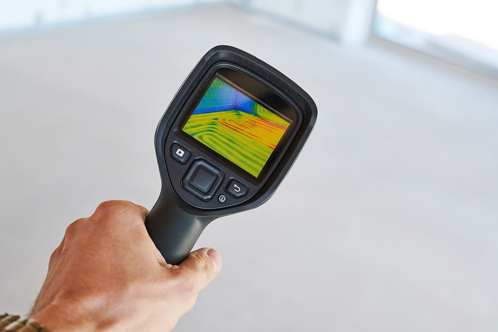 Option One technician using leak detection equipment
