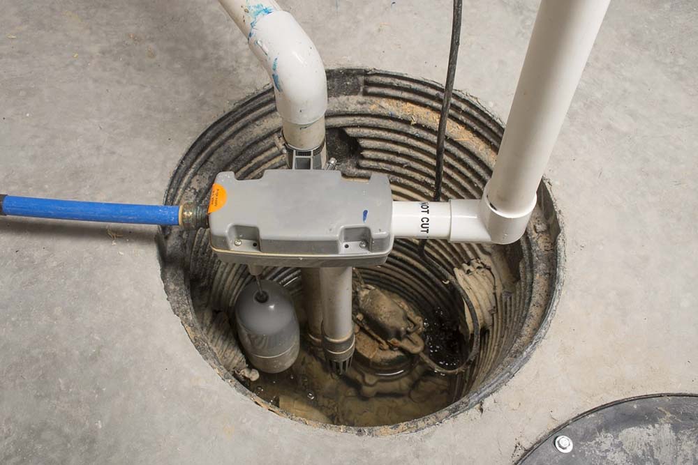 Option One technician installing a sump pump
