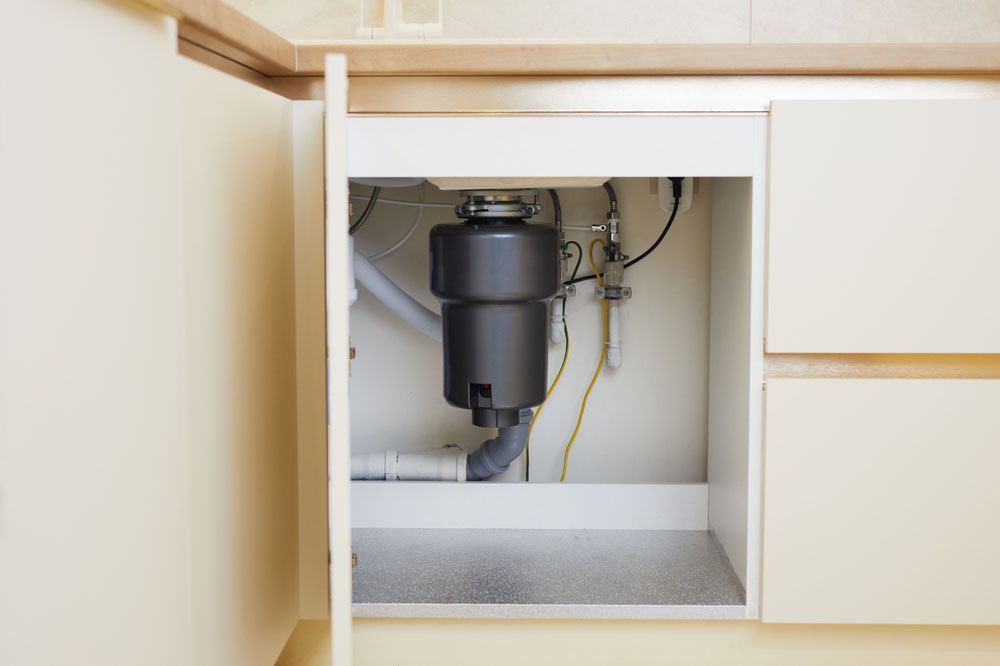 whirring garbage disposal unit